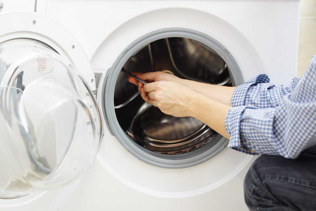 Dryer repair technician at work