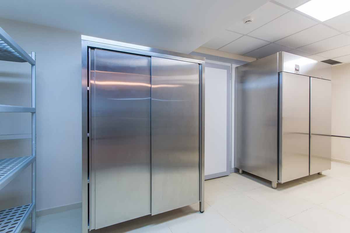 Industrial-sized refrigerators in commercial kitchen